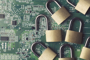 Poster - Padlock on a computer electronic circuit board. Technology security concept