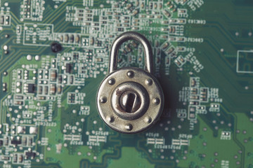 Poster - Padlock on a computer electronic circuit board. Technology security concept