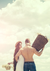 Wall Mural - Couple in love hug on cloudy sky