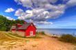 Red cottage house at the beach of  Baltic sea in Sweden