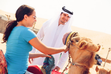 Canvas Print - Arabian Man And Tourist Riding A Camel