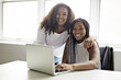 © Louis-Paul Photo - Two teen at desk in her office with laptop