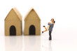 © polymanu - Miniature couple, couple hugged area front of house.  Used in the Valentine's day concept.