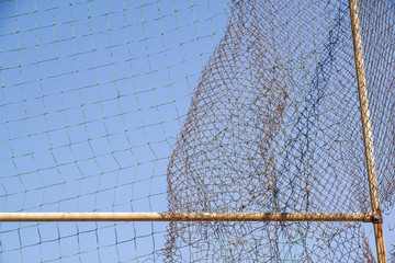 damage wire mesh steel on blue sky background