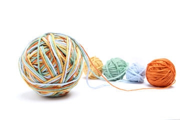 Wall Mural - colorful big thread ball from four color thread. cotton thread balls isolated on white background. d