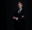 © ASDF - Full-length portrait of business man  isolated on black backgrou