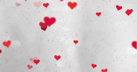 Wall Mural - red colored hearts flying around on blurry silver bokeh background.