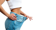 Woman In Oversize Jeans After Weight Loss.