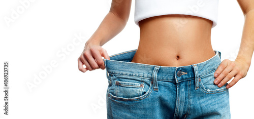 Fotografía Woman is measuring waist after weight loss,. Diet concept