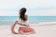 © zolotareva_elina - beautiful young stylish woman in pink skirt on the beach