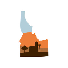 idaho state shape with farm at sunset w windmill, barn, and a tree