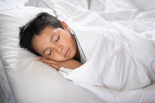 Boy Sleeping On Bed With White Sheet And Pillow.asian Kid Fall Asleep Daydreaming.sleep Concept