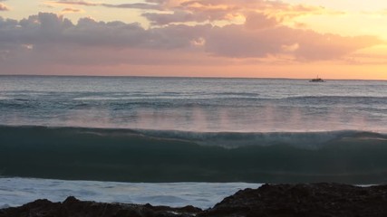 Wall Mural - shorebreak ocean waves near rocky coast and cliffs, rough sea water at sunset time