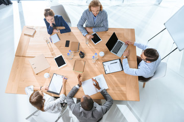 business team working while siting at table at office space