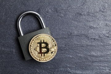 Poster - bitcoin security concept. Gold coin with padlock