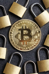Poster - bitcoin security concept. Gold coin with padlock