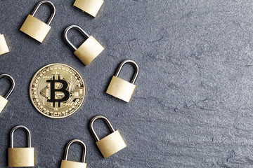 Poster - bitcoin security concept. Gold coin with padlock