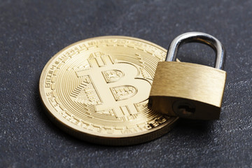Poster - bitcoin security concept. Gold coin with padlock