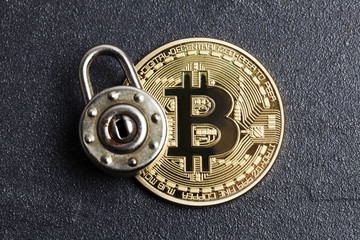 Poster - bitcoin security concept. Gold coin with padlock