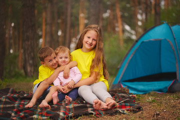 happy children hiking in the forest