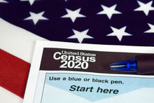 Close Up Of 2020 Census Document Form And Ballpoint Pen On American Flag