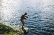 © Simonfocus/Stocksy - Nude man yelling at the lake