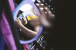© GIC/Stocksy - Young woman buying sunglasses