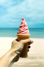 Plastic Ice Cream Cone On The Beach Background