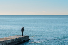 Lone Fisherman On The Sea Pier, Sea Fishing