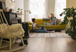 © Ivo de Bruijn/Stocksy - Two woman in a cosy small living room, relaxing.