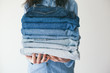 © VeaVea/Stocksy - Woman holding jeans