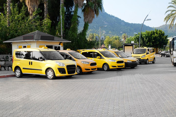 Taxi cars standing in parking zone