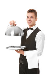 Wall Mural - Waiter with metal tray and cloche on white background