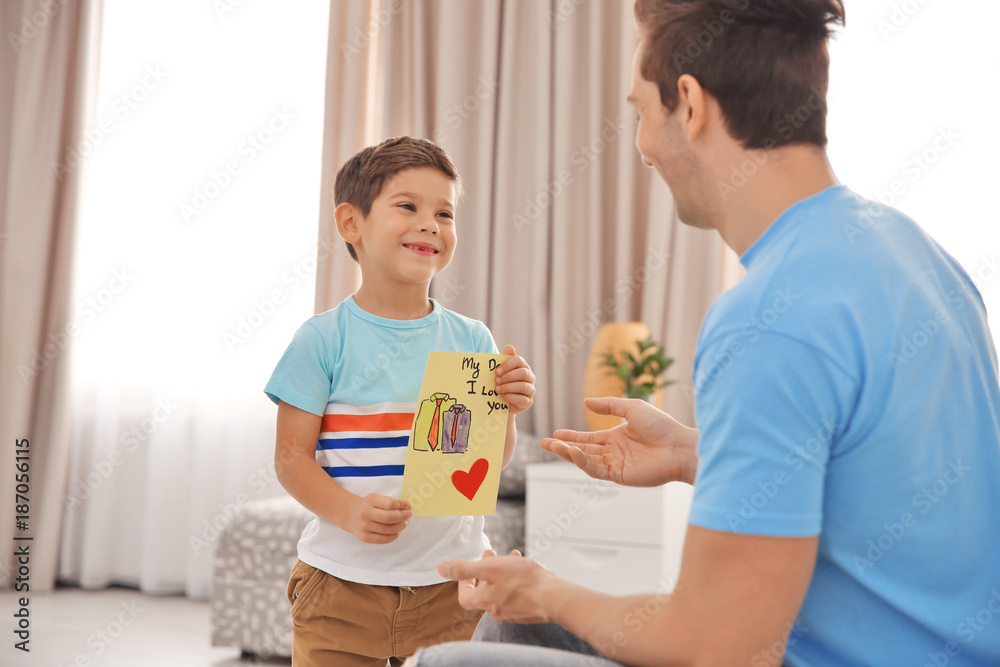 Little boy greeting his dad with Father's Day
