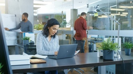 Time-Lapse of the Working Day of a Beautiful Hispanic Businesswoman. She Works in a Busy International Office where Diverse Team of Talented Young People. Shot on RED EPIC-W 8K Helium Cinema Camera.