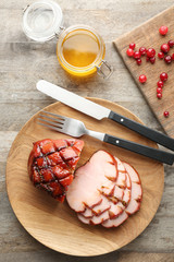 Wall Mural - Dish with traditional sliced honey baked ham on table