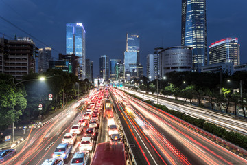Wall Mural - Traffic light trails in the heart of Jakarta business district in Indonesia capital city.