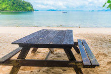 Table And Benches On A Sandy Beach On The Background Of The Sea