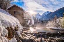 Water From Lake Fusine Flows Over Dam In River