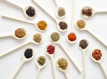 Dried Spices On White Spoons