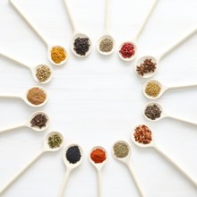 Dried Spices On White Spoons