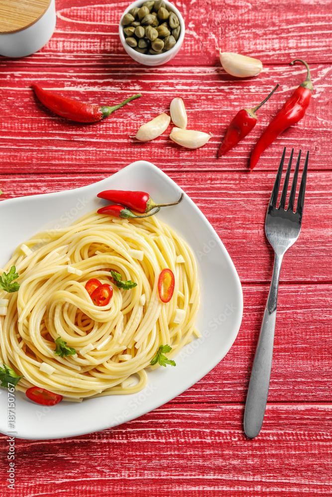 Delicious pasta with garlic and chili pepper on plate