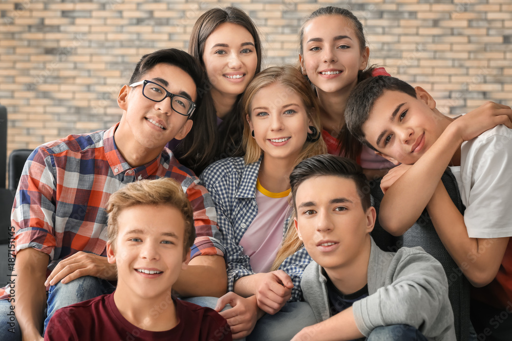 Group of funny teenagers indoors