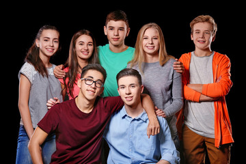 Poster - Group of cool teenagers on dark background