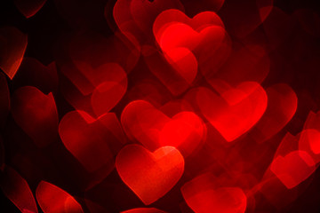 Red Hearts Background with Bright Bokeh Lights for Valentine's Day or Christmas