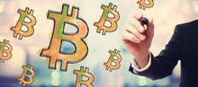 Bitcoinb With Businessman On Blurred Abstract Background