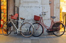 Old Fashioned Bicycles Parked In Front Of Shops - Ferrara, Emilia-Romagna, Italy