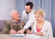 © JackF - Woman and eldery man signing agreement