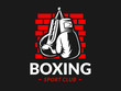 Silhouette of boxing gloves against a brick wall background - boxing emblem, logo design, illustration on a black background