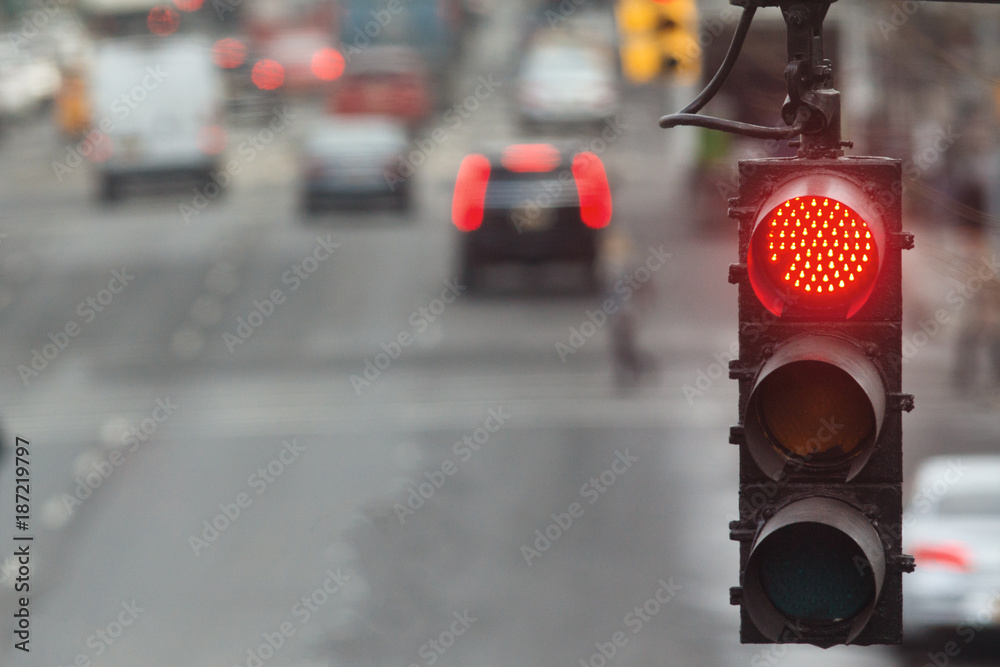 Traffic light in the city with red signal on the background of the road - obrazy, fototapety, plakaty 